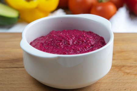 Delicious healthy beetroot salad on wooden background. Diet concept.