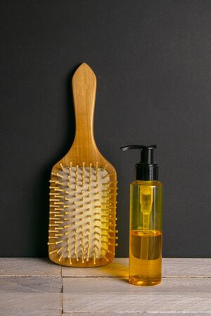 Hair gel and comb for haircut stand on a white table. Hairdressing concept.の写真素材