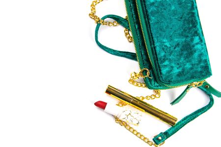 Tulips with green women's clutch and women's cosmetics on a white background.の写真素材