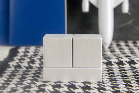 Airplane, passport and wooden cubes on which you can write a date. Front viewsの写真素材