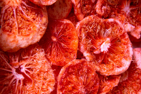Christmas background of dried fruits. dried grapefruit background. Top views, close-up