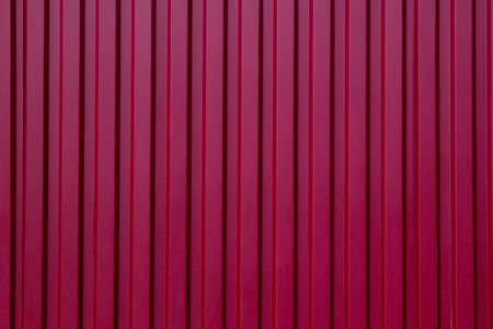 Panorama of Red Corrugated metal background and texture surface or galvanize steel , Red metal sheet wall or fence seamless backgroundの写真素材