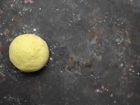 Raw yeast dough for pizza, bread or pasta. Dark food background. Copy space for textの写真素材