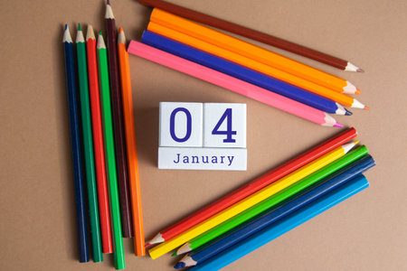 January 4 on the wooden calendar. The fourth day of the winter month, a calendar for the workplace....