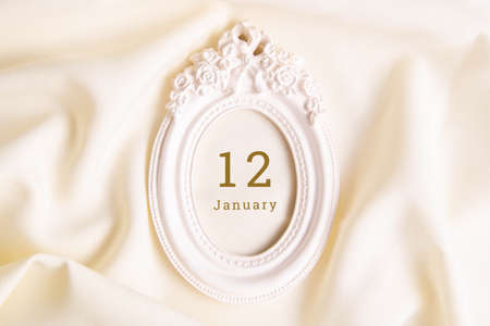 January 12 on the wooden calendar. The twelfth day of the winter month, a calendar for the workplace. Winter.の写真素材