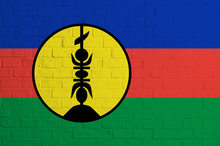 Flag of New Caledonia. Brick wall texture of the flag of New Caledonia.の写真素材