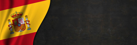 Spain flag on concrete wall. Banner with fabric texture of the flag of Spain.の写真素材