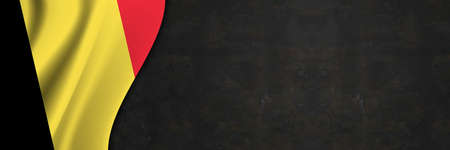 Belgium flag on concrete wall. Banner with fabric texture of the flag of Belgium.の写真素材