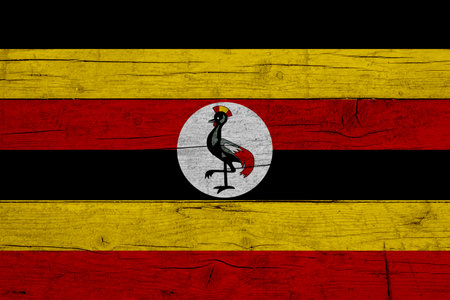 Flag of Uganda. Wooden texture of the flag of Uganda.の写真素材