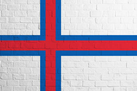 Flag of Faroe Islands. Brick wall texture of the flag of Faroe Islands.の写真素材