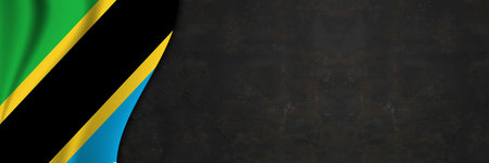 Tanzania flag on concrete wall. Banner with fabric texture of the flag of Tanzania.の写真素材