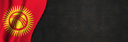 Kyrgyzstan flag on concrete wall. Banner with fabric texture of the flag of Kyrgyzstan.の写真素材