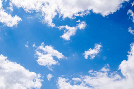 Cumulus clouds in the blue sky and sunbeams break through the clouds. Copy space.の写真素材