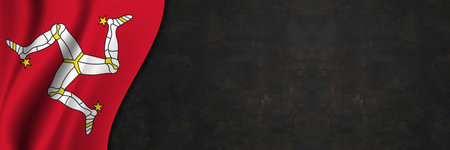 Isle of Man flag on concrete wall. Banner with fabric texture of the flag of Isle of Man.