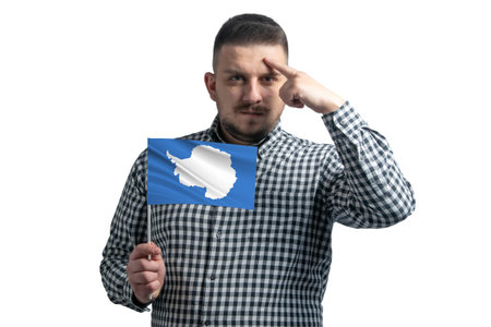 White guy holding a flag of Antarctica and a finger touches the temple on the head isolated on a white background.の写真素材