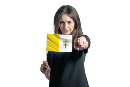 Happy young white woman holding flag of Vatican and points forward in front of him isolated on a white background.の写真素材