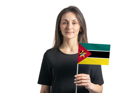 Happy young white girl holding Mozambique flag isolated on a white background.の写真素材