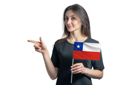 Happy young white woman holding flag Chile and points to the left isolated on a white background.の写真素材