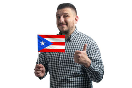 White guy holding a flag of Puerto Rico and shows the class by hand isolated on a white background. Like for Puerto Rico.の写真素材