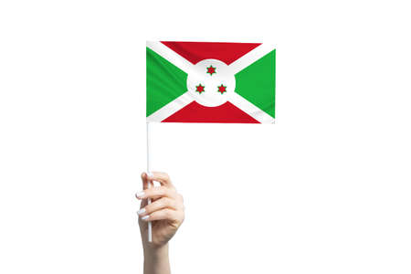 Beautiful female hand holding Burundi flag, isolated on white background.の写真素材
