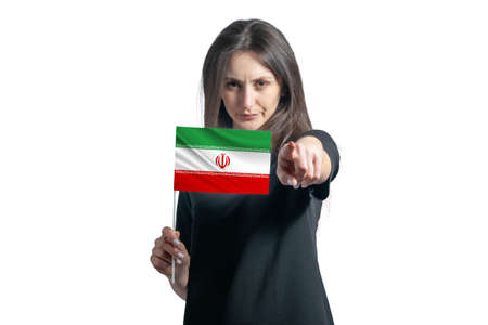 Happy young white woman holding flag of Iran and points forward in front of him isolated on a white background.の写真素材