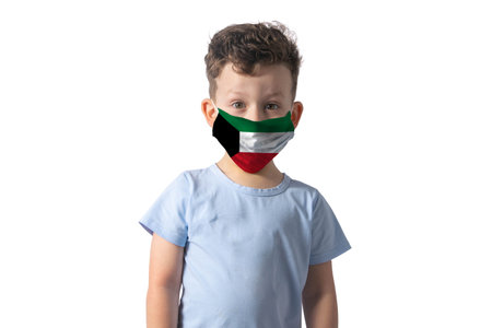 Respirator with flag of Kuwait White boy puts on medical face mask isolated on white background.の写真素材