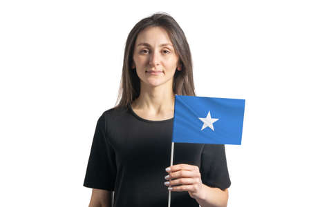Happy young white girl holding Somalia flag isolated on a white background.の写真素材