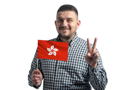 White guy holding a flag of Hong Kong and shows two fingers isolated on a white background.の写真素材