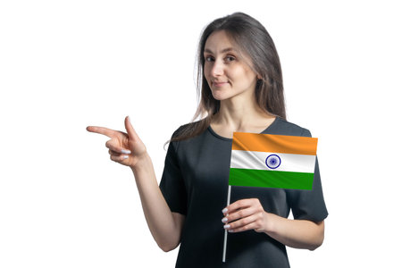 Happy young white woman holding flag India and points to the left isolated on a white background.の写真素材