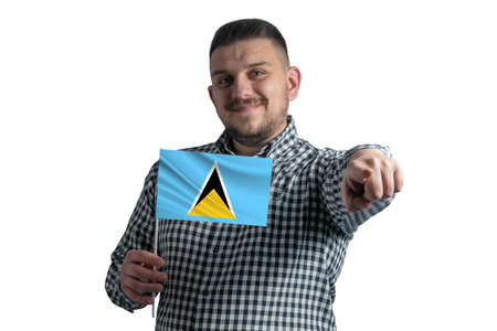 White guy holding a flag of Saint Lucia and points forward in front of him isolated on a white background.の写真素材
