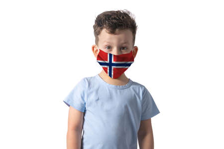 Respirator with flag of Norway. White boy puts on medical face mask isolated on white background.の写真素材