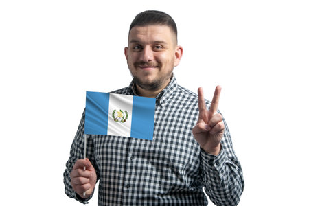 White guy holding a flag of Guatemala and shows two fingers isolated on a white background.の写真素材