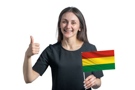 Happy young white woman holding flag of Bolivia and shows the class by hand isolated on a white background.の写真素材