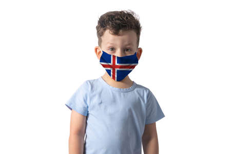 Respirator with flag of Iceland White boy puts on medical face mask isolated on white background.の写真素材