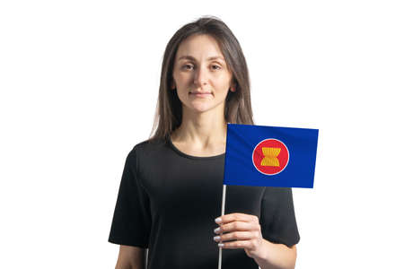 Happy young white girl holding Association of Southeast Asian Nations flag isolated on a white background.の写真素材