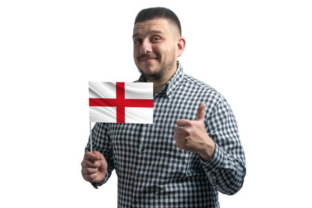 White guy holding a flag of England and shows the class by hand isolated on a white background. Like for England.の写真素材