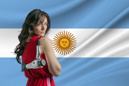 Beauty industry in Argentina. Happy female hairdresser holding hairdryer against Argentina flag background.の写真素材