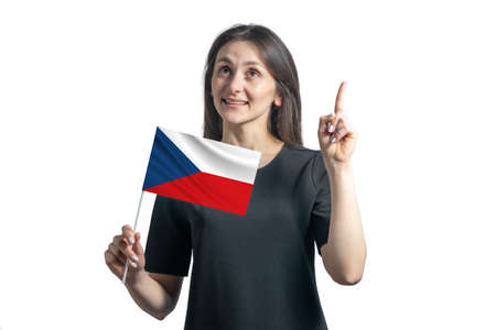 Happy young white woman holding flag of Czech Republic and points thumbs up isolated on a white background.の写真素材