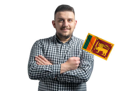 White guy holding a flag of Sri Lanka smiling confident with crossed arms isolated on a white background.の写真素材