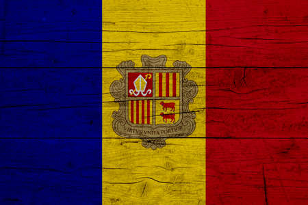 Flag of Andorra. Wooden texture of the flag of Andorra.の写真素材