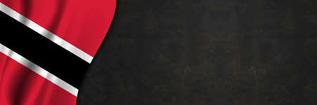 Trinidad and Tobago flag on concrete wall. Banner with fabric texture of the flag of Trinidad and Tobago.の写真素材
