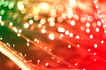 Abstract holiday lights garlands. Photographed with shallow depth of field. The background is...