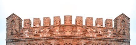 Old red brick fortress with battlements on the roof. Visible irregularities and chips on the bricks.の写真素材