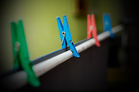 Clothespins in the photo the rack holds the background paper in black. Stock aluminum photo.の写真素材