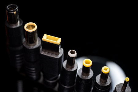 Several electro connectors on a black background shot in macro mode. Visible metal connectors of...