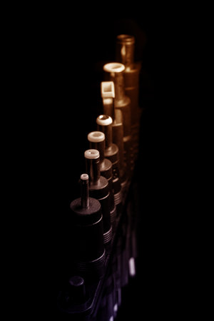 Several electro connectors on a black background shot in macro mode. Visible metal connectors of...