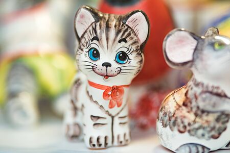 Colored small toys made of porcelain. The background is blurred. Shallow depth of field.の写真素材