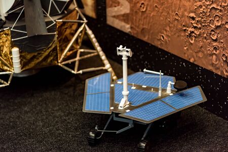 The satellite is a research all-terrain vehicle made of metal and plastic. The background is blurred.の写真素材