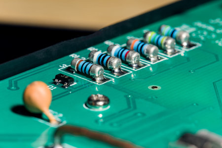 A close-up microchip with many electrical components placed on the Board. The background is blurred.