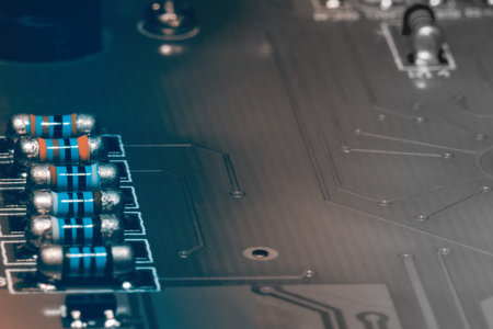A close-up microchip with many electrical components placed on the Board. The background is blurred.